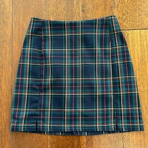 Brandy Melville navy, green and red tartan mini skirt with zip at the back.